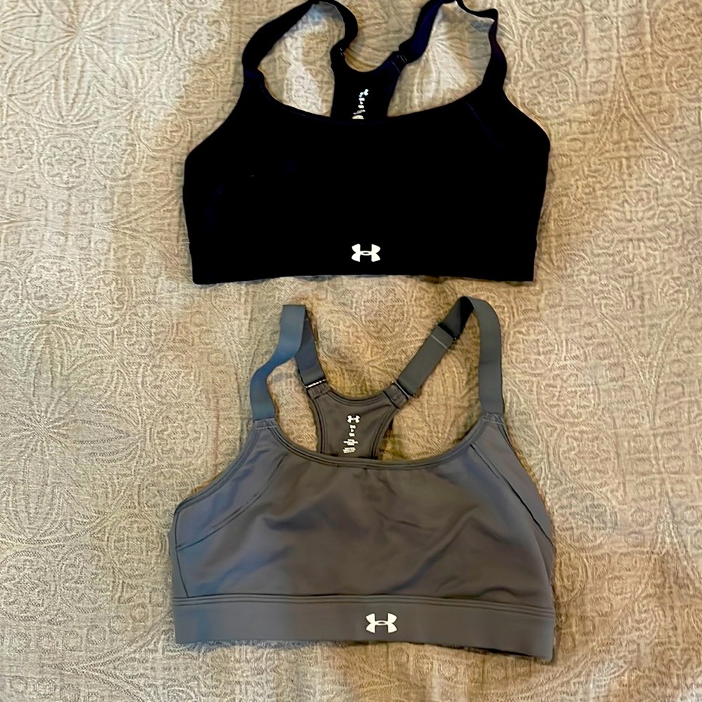 Fitted sorts bras. One black, one gray.